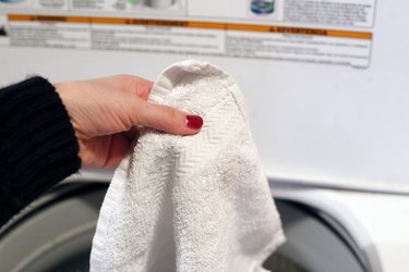 Washing white towels with Mrs. Stewart's Liquid Bluing