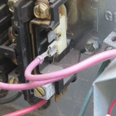 Red wire attached to metal tab contact.