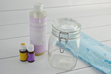 You need water, castile soap, lemon essential oil, lavender essential oil, cloth wipes and an airtight container.