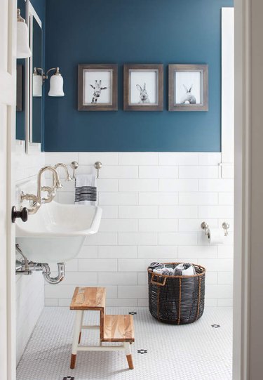 modern farmhouse bathroom with cerulean blue paint and white subway tiling