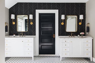 midcentury bathroom with black chevron backsplash tile