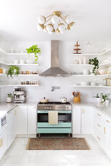 white kitchen with greens