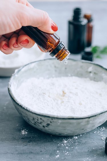 Essential oil added to bowl of baking soda
