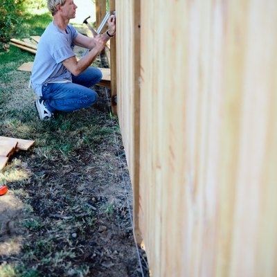 Man Building a Fence