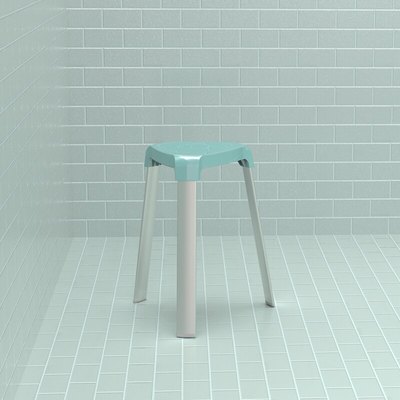 A three-legged alumnium stool with a light blue seat and grey legs sits in a corner with rectangular light blue tile.