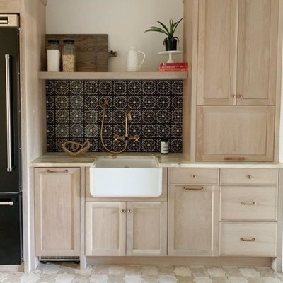 star motif Moroccan kitchen floor tiles with wood cabinets
