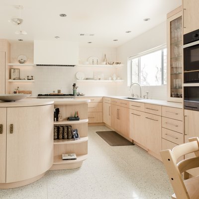 kitchen with blonde wood cabinets and white rectified tile floor