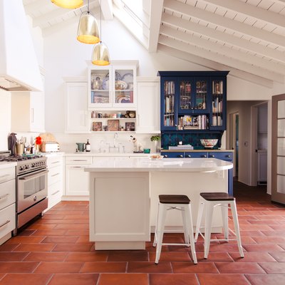 clay tile floor in kitchen, white cabinetry