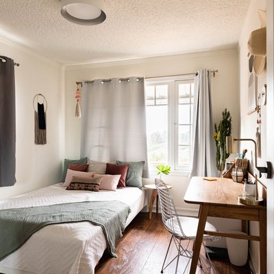 bedroom with small desk nearby
