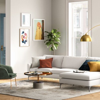 bright modern living space with white couch and colorful accents
