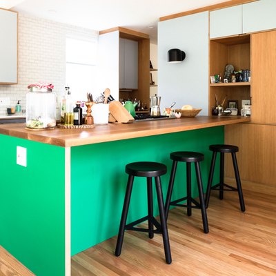 kelly green midcentury kitchen island idea with wood countertop