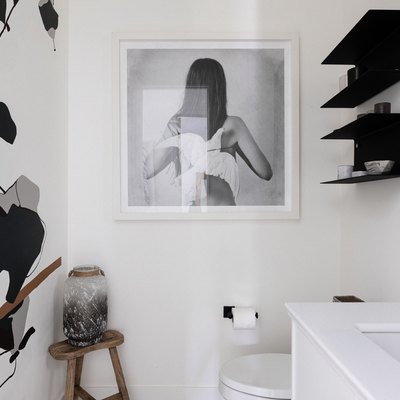 black and white bathroom idea with wooden stool in corner
