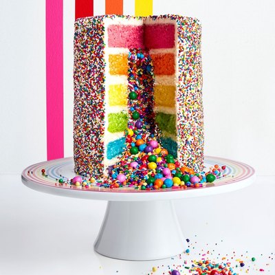 rainbow explosion cake on stand