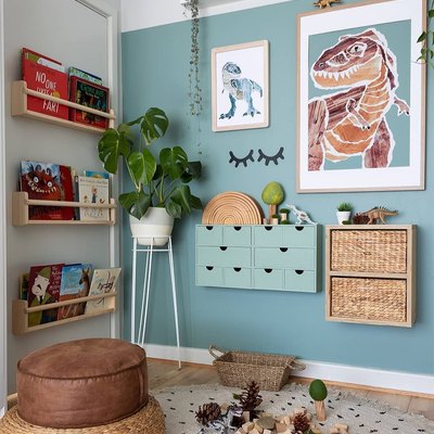 Jurassic themed boys bedroom idea with blue walls and potted plants