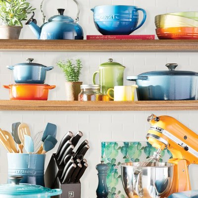 colorful kitchenware on shelves and counter