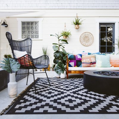 Patio furniture on black and white rug