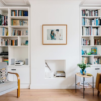 bookshelves in a living room with hardwood floors
