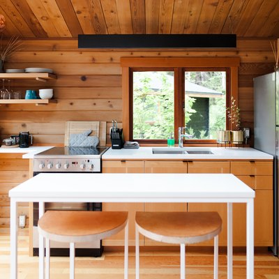wood walls and flooring in a simple cabin kitchen