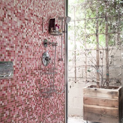 modern shower idea with colorful mosaic tile wall and linear drain