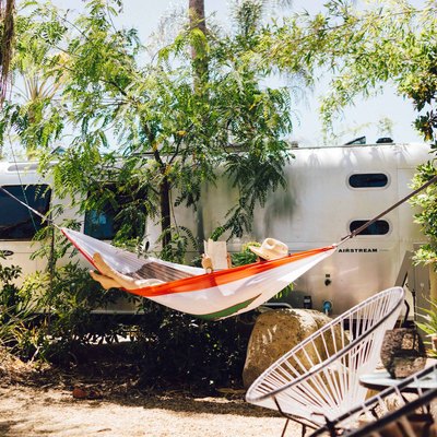 hammocks at caravan outpost with airstream trailer