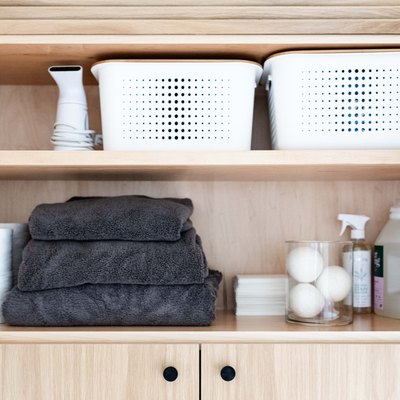 Storage baskets in laundry closet