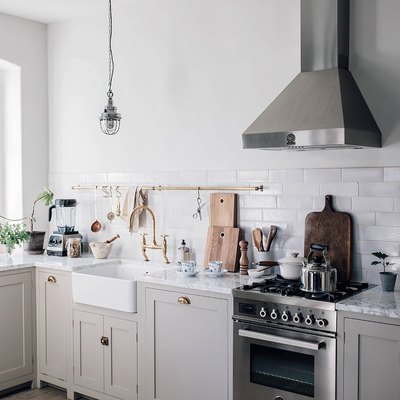 gray kitchen cabinets with stainless steel appliances