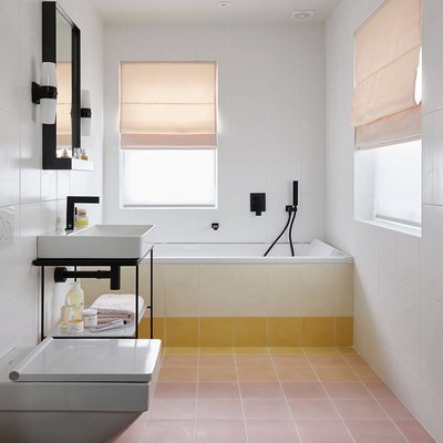 Minimalist bathrooms with terra cotta tile and roman shades