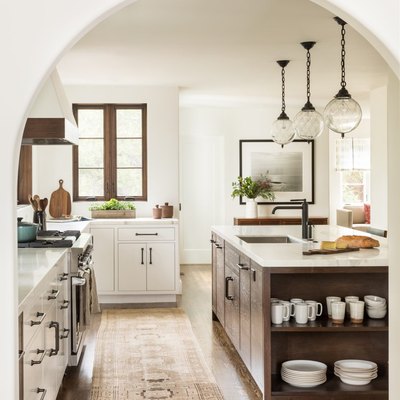 country kitchen with rustic kitchen island and three pendant lights