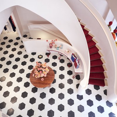 overhead view of black and white floor and large staircase