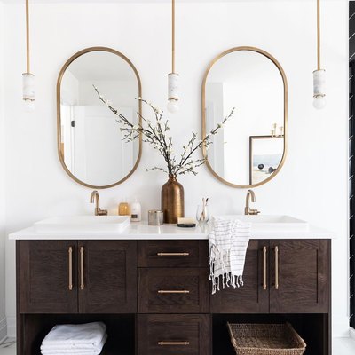 elegant bathroom lighting idea with trio of mini pendant lights with marble