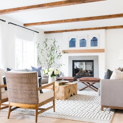 white, grey and blue coastal family room with exposed wood beams