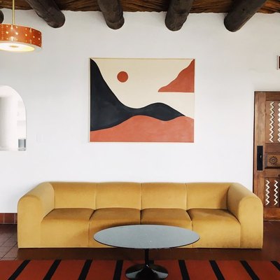 minimalist with color in retro living room with yellow sofa