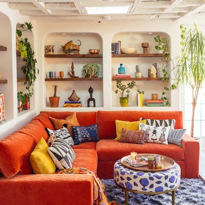small family room ideas with shelving and orange sofa