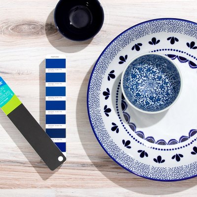 pantone color swatch next to dinnerware