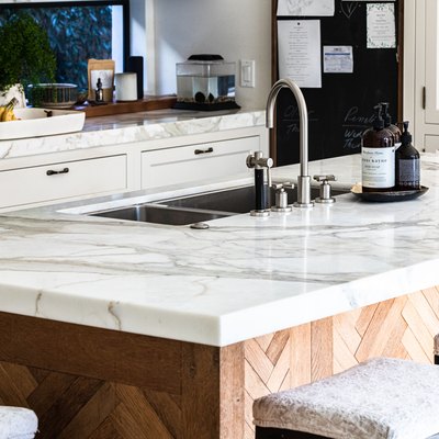 kitchen marble countertop on kitchen island with sink with high-arc faucet