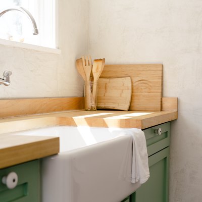 wall-mount faucet, farmhouse sink and butcher block kitchen countertop