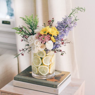 Lemons in a vase with flowers
