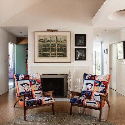 living space with cork floors, colorful chairs, entryway into two happways