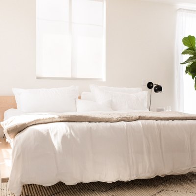 hunker house bedroom with modern side tables and black sconces