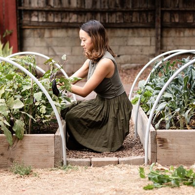 Woman tending to her vegetable garden
