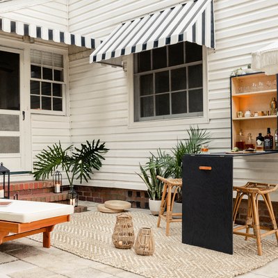 Patio with folded down Murphy bar mounted to wall