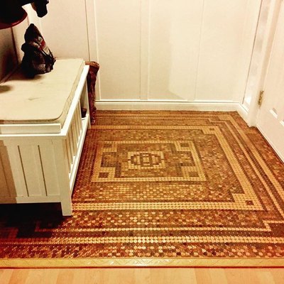 entryway with floor made out of pennies