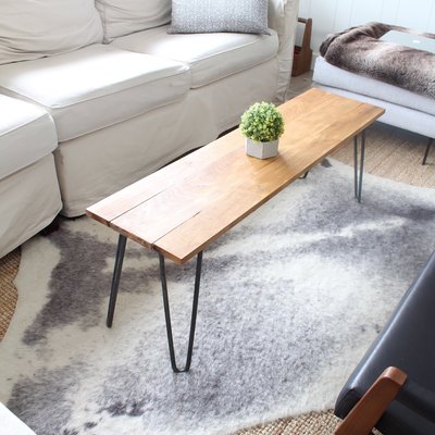 DIY rustic coffee table with hairpin legs and wood tabletop in modern living room