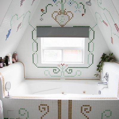 whirlpool tub surrounded by decorative, colorful tile