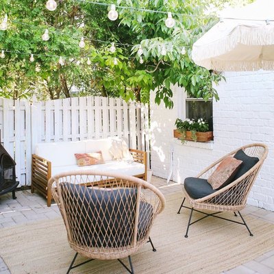 wooden window flower box with white brick wall