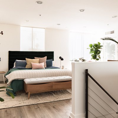 Hunker House bedroom with upholstered headboard and bed bench
