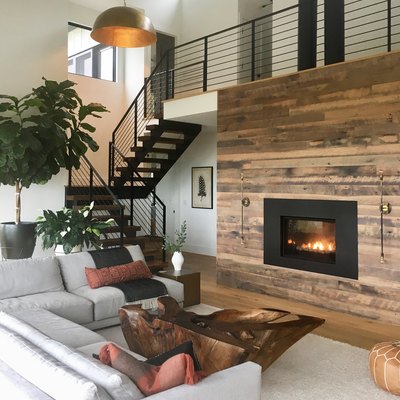 Rustic living room idea with large wood fireplace