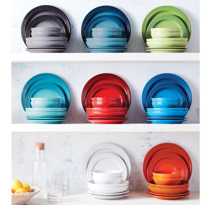 colorful dinnerware on white shelvers