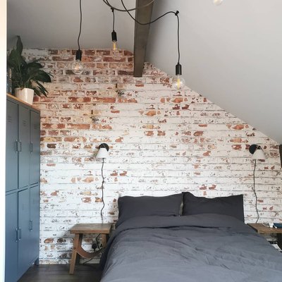 whitewashed brick wall industrial wallpaper in a bedroom
