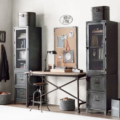 industrial office idea with metal cabinets and cork board on wall